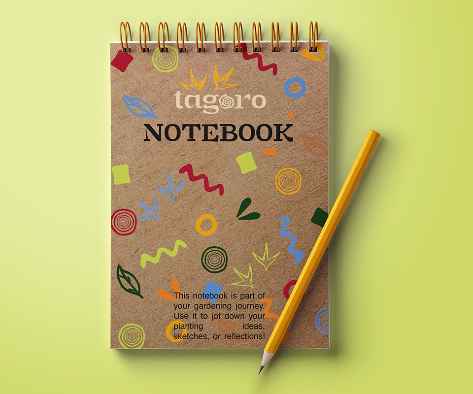 notebook with colourful patterm of zigzags, bird footprint, cirlces, squares, and tagoro swirl.