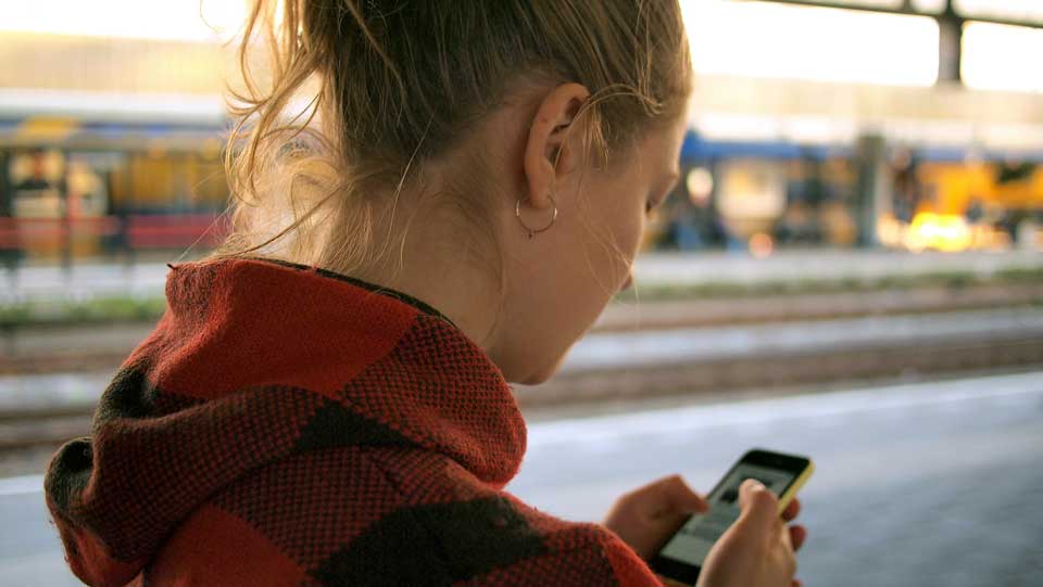 girl looking at phone